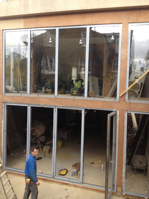 Aluminium bi-fold doors with two-storey glazing in Westcombe Park
